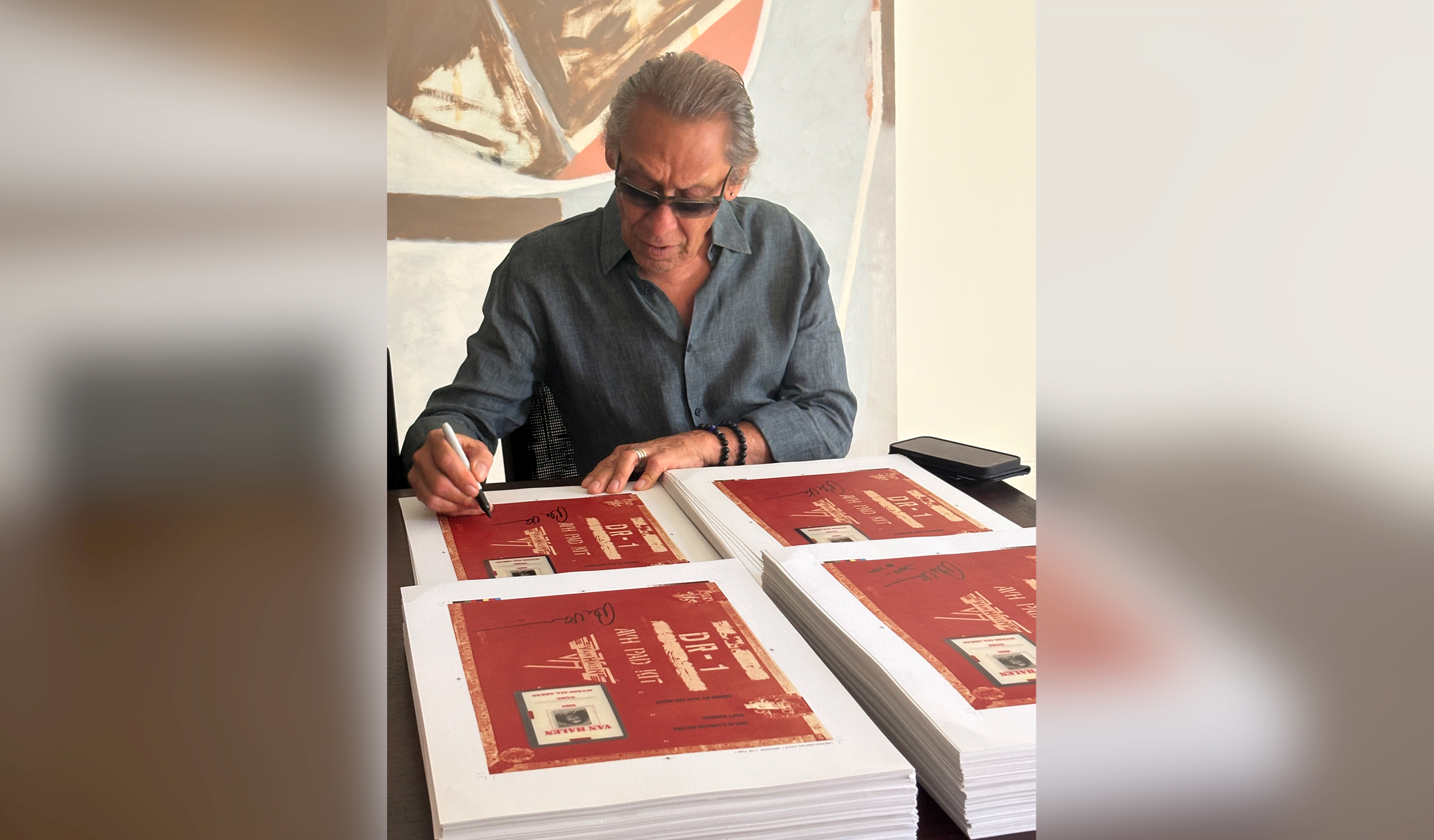 Alex Van Halen signing the limitation pages for VAN HALEN